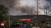 Cooler temps and rain could help corral blazes that forced thousands to flee New Mexico village - Times of India