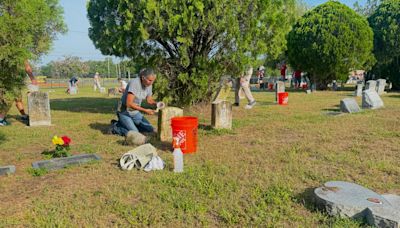 Neighbors, advocates clean up historical Memorial Park Cemetery for Memorial Day
