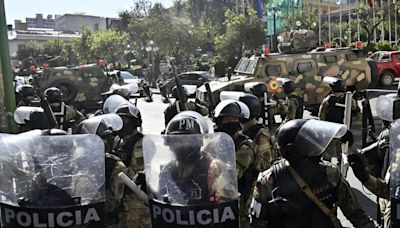 Bolivia coup fears explode as armoured vehicle rams into presidential palace