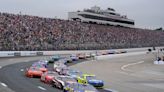 Christopher Bell takes the checkered flag on rain tires in the NASCAR Cup race at New Hampshire