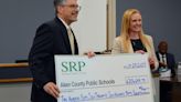 Credit union presents over $250K from debit card earnings to Aiken County Public School District