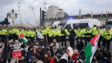 Hundreds of pro-Palestinian protesters block Westminster Bridge with sit-in calling for ceasefire