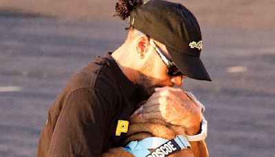 Lewis Hamilton plants a kiss on his beloved bulldog Roscoe