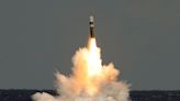 Trident test which saw missile 'plop' into sea near UK submarine was success in almost every regard, says minister