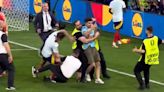 Spain's Alvaro Morata suffers injury scare after security guard slides into him during celebrations