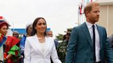 Meghan Changes Into a White Suit With Flared Pants for Second Engagement in Nigeria