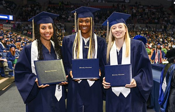 Paige Bueckers, Aaliyah Edwards dance at Gampel Pavilion as the UConn stars take part in graduation