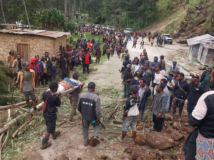 Emergency crews in Papua New Guinea move survivors of massive landslide to safer ground