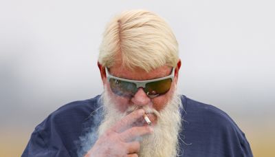 John Daly puffs cigarette in very bold outfit at Royal Troon ahead of The Open