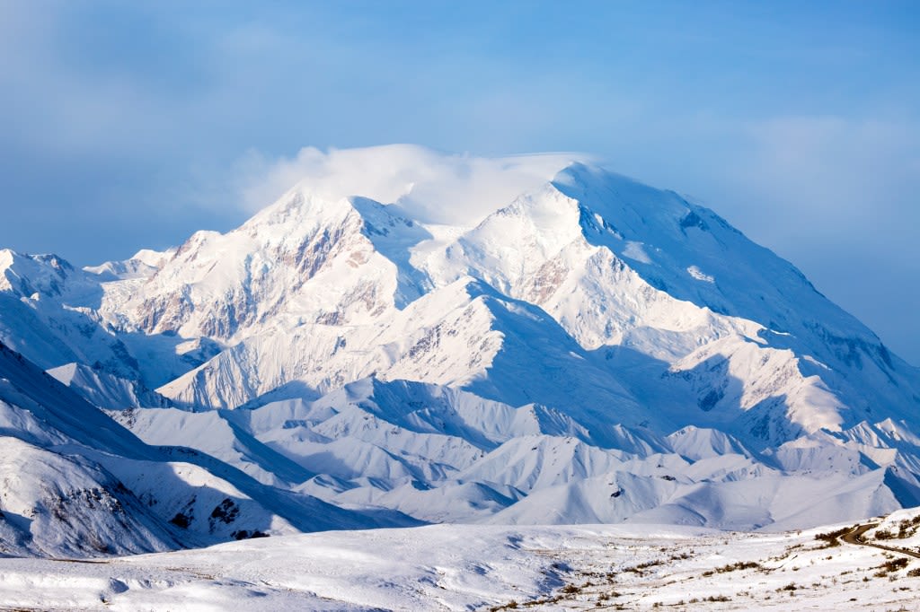 Two hypothermic climbers waiting for rescue on Denali, North America's tallest mountain