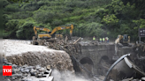 Rescuers search for dozens missing after flooding and a bridge collapse in China kill at least 25 - Times of India