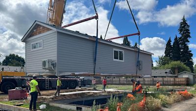 Tiny homes craned into Vancouver neighborhood to create community for those transitioning out of homelessness