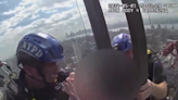 Video: Woman rescued by NYPD officers atop 54-story building in Manhattan