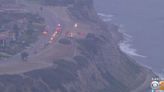 1 found dead, 3 injured on beach after falling down 300-foot cliff
