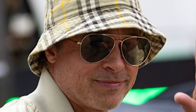 Brad Pitt rocks £320 Burberry as he arrives at Silverstone circuit