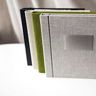 Printed on high-quality paper and bound in a hardcover, these photo books are durable and long-lasting. They come in a variety of sizes and can be customized with different cover materials, such as linen or leather. Hardcover photo books are popular for wedding albums, family photo albums, and travel photo books.