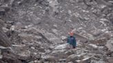 At least 34 dead in China landslide; rescuers still searching for 10 missing