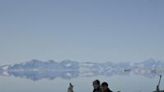 Greenland's greatest Inuit polar bear hunter Hjelmer Hammeken (L) and his young protege Martin Madsen out on the ice