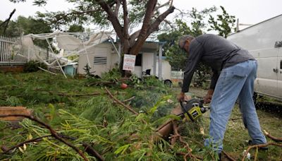 Hurricane Ernesto knocked out power to half of Puerto Rico and is strengthening as it heads toward Bermuda