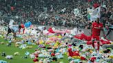 Besiktas fans throw toys onto pitch in support of those affected by earthquakes