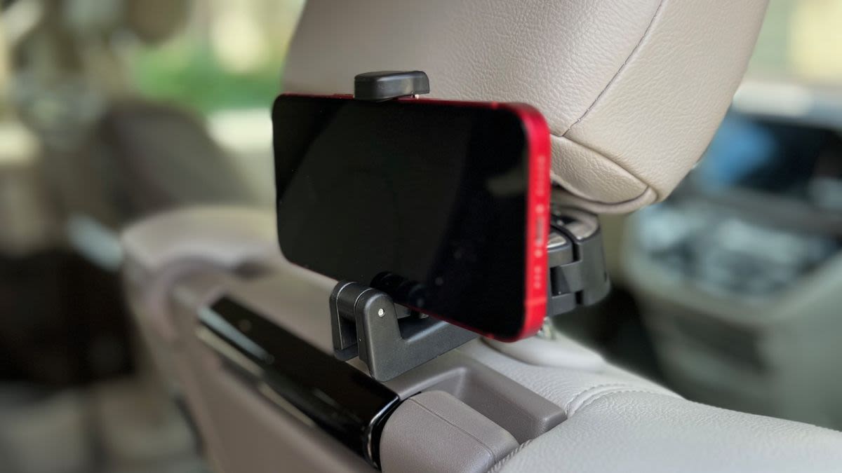 I tried this $9 car headrest hook that holds bags and phones for backseat viewing
