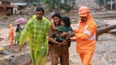 Twenty-four dead, dozens trapped in India landslides