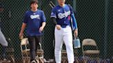 Shohei Ohtani of the Los Angeles Dodgers and interpreter Ippei Mizuhara arrive to a game against the Chicago White Sox at Camelback Ranch on Feb...