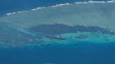 China says Philippine warships 'damaged' reef at atoll in South China Sea