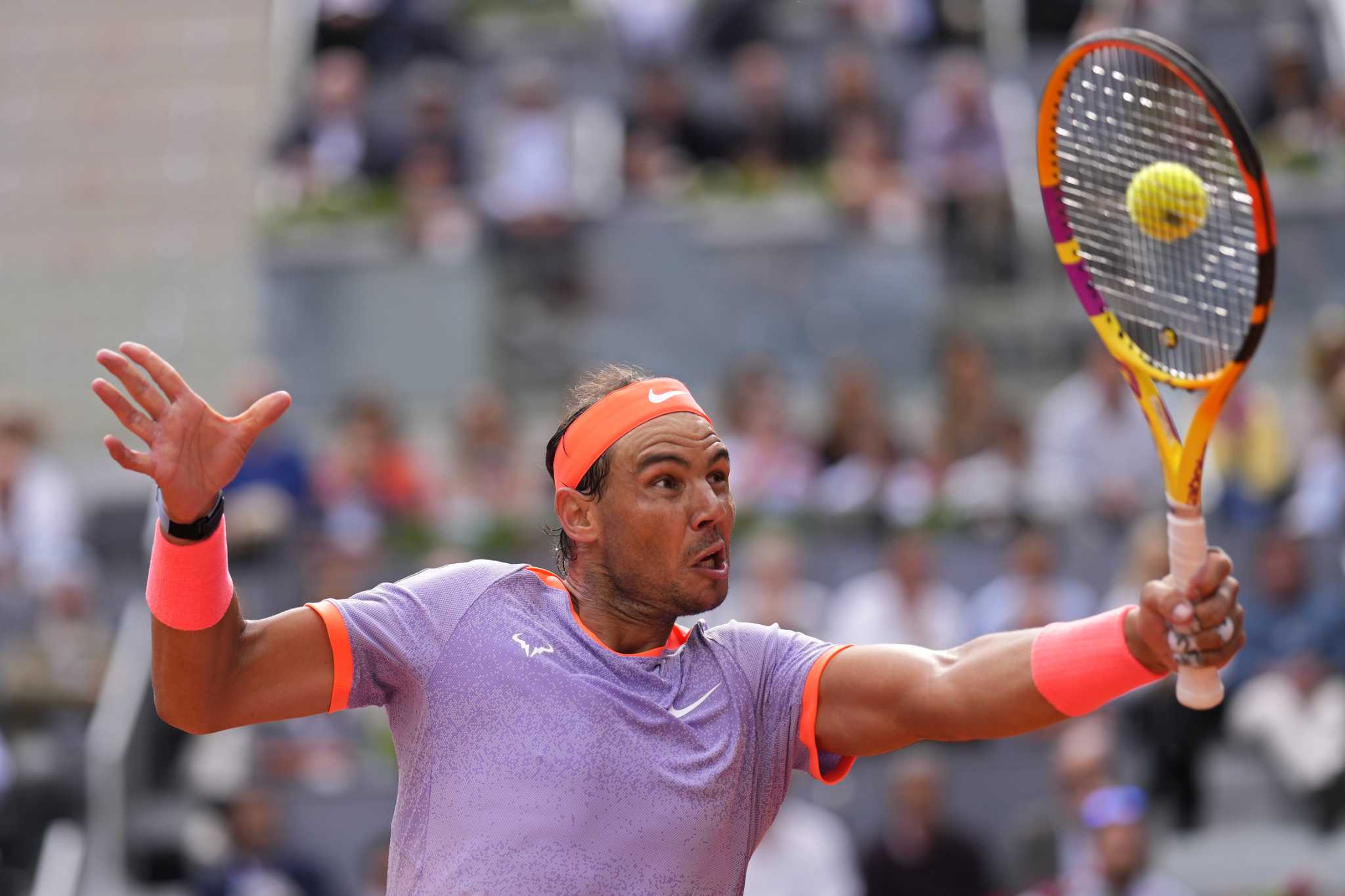 Nadal tested in a 3-hour win over Cachin at Madrid. Swiatek reaches the women's quarterfinals