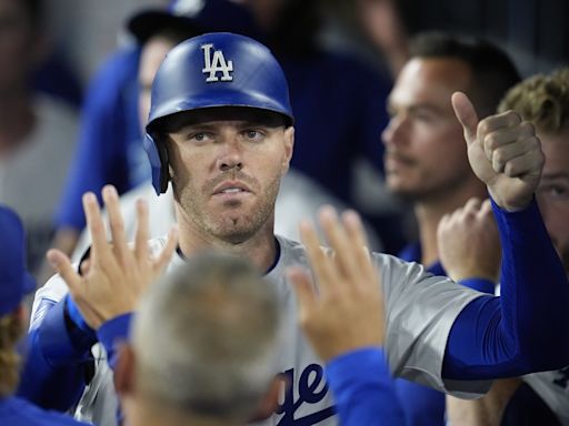Dodgers' Freddie Freeman scratched, returning to Los Angeles to be with family