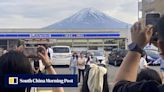 Japanese town blocks view of Mount Fuji to fend off badly behaved tourists