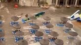Watch as 'meteo-tsunami' sends Menorca tourists running & washes away sunbeds