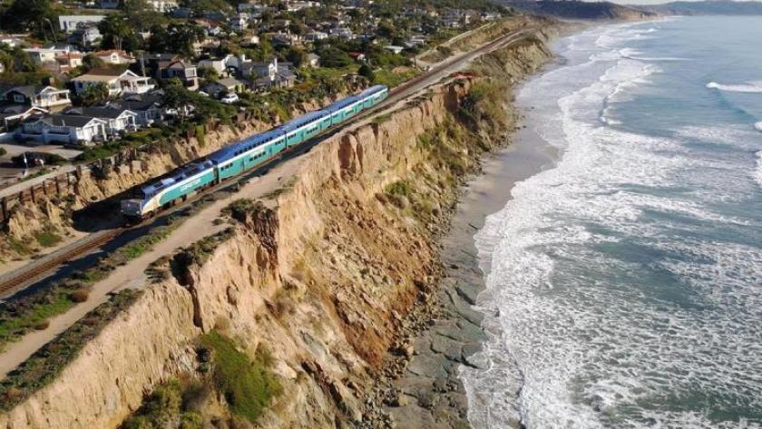 Del Mar bemoans loss of sand, beach in efforts to protect bluff-top train tracks, but is warned: 'It is imperative that these walls go up as soon as possible.'