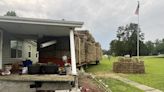 Trailer carrying hay crashes into porch of home, Horry County Fire Rescue says