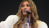 Delta Goodrem's fashion regret sees her carried to stage at festival