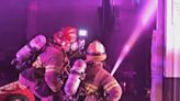Crews battle fire at SW Portland car dealership
