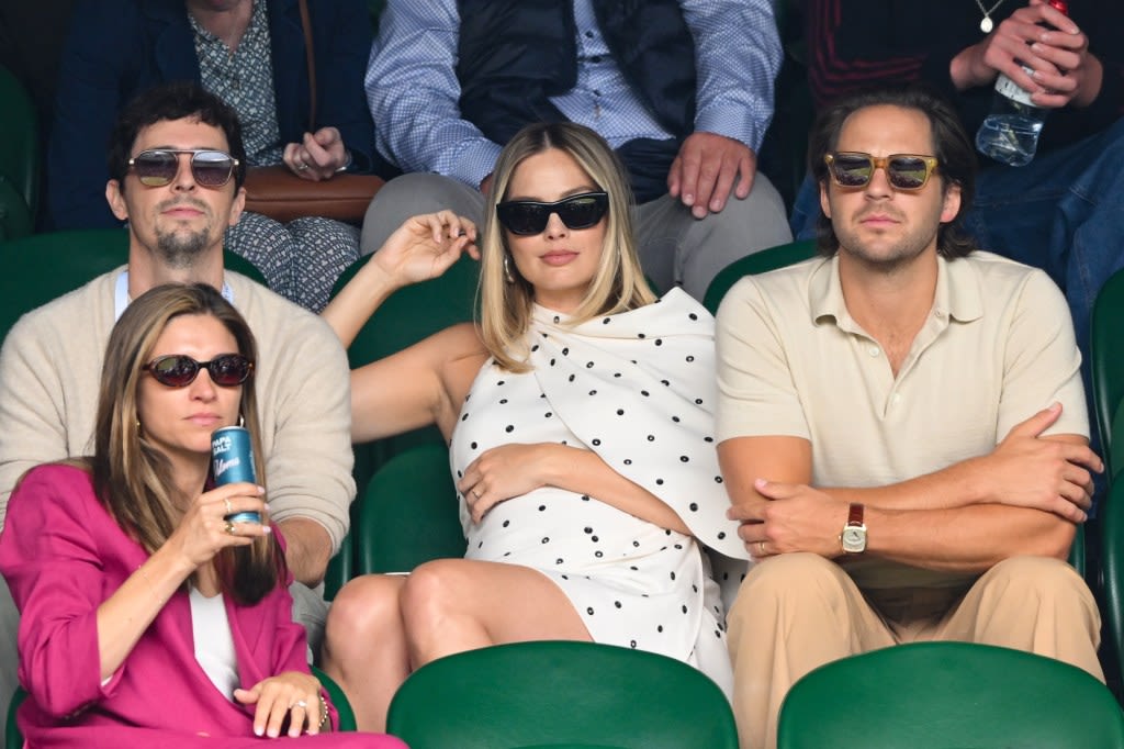 Margot Robbie shows off growing baby bump at Wimbledon in first outing since pregnancy news