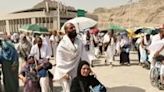 Muslim pilgrims arrive to perform the symbolic 'stoning of the devil' ritual as part of the hajj in Mina, near Saudi Arabia's holy city of Mecca, during oven-like heat conditions