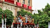 Faithful line streets of Seville, Spain, for Holy Week processions