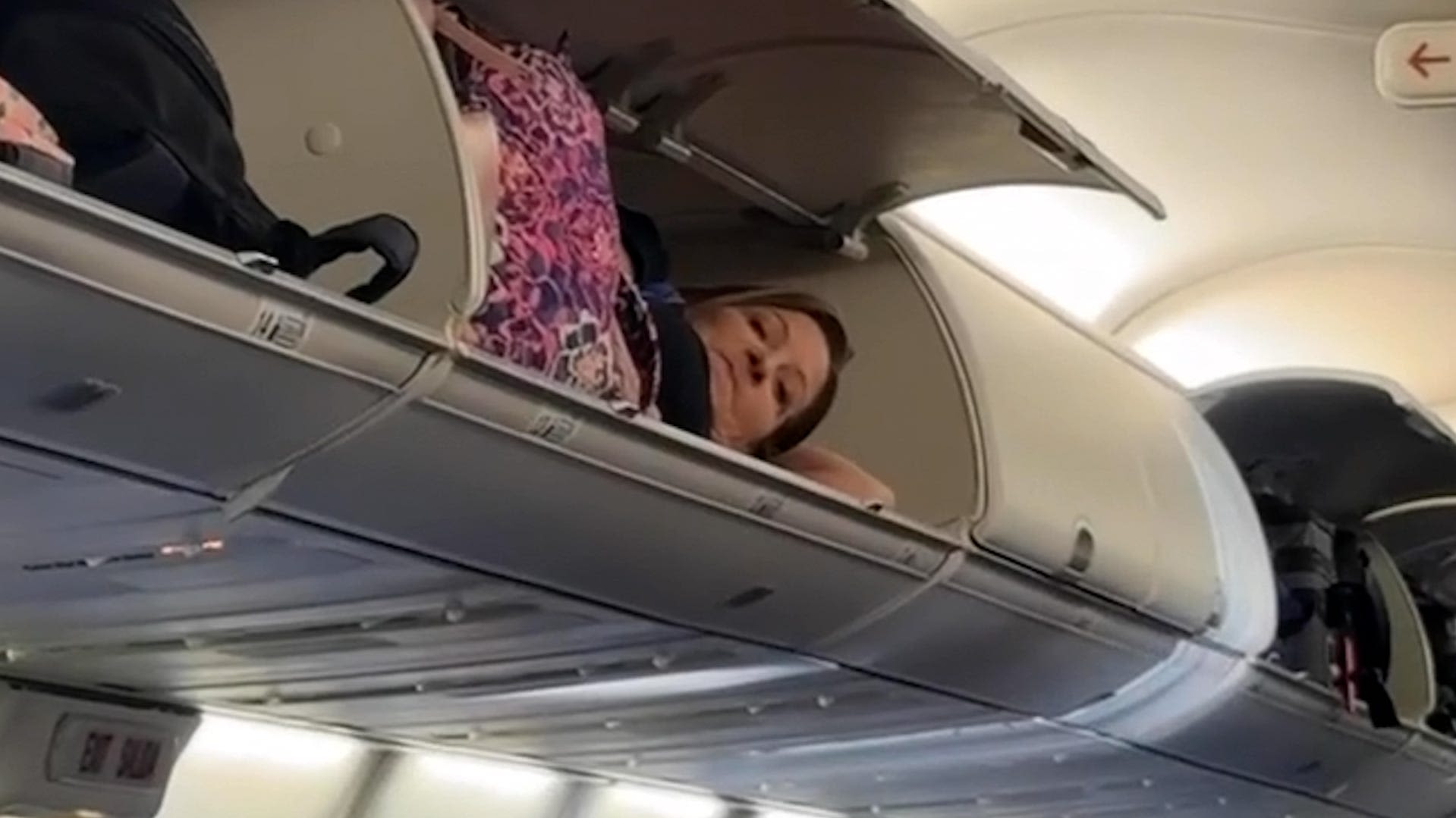 Southwest Airlines 'looking into' video of woman lying inside overhead bin before takeoff