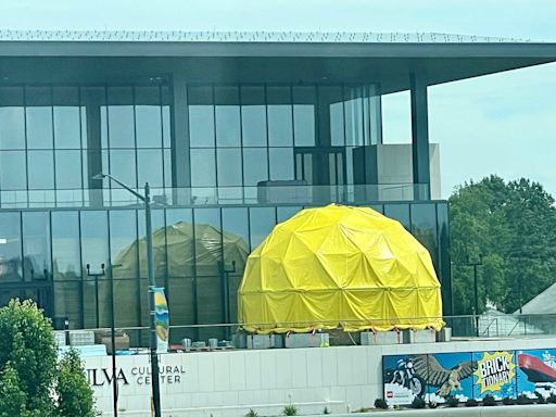 A mysterious yellow dome has popped up outside the Mulva Cultural Center in De Pere this summer. What's it all about?