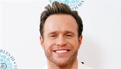 Olly Murs is a doting dad as he cradles baby daughter Madison in new photo