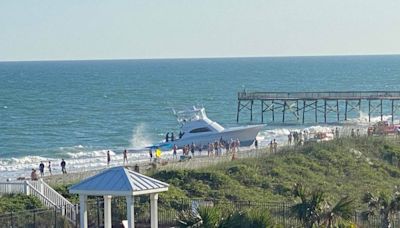 Witnesses capture video, photos of moment boat runs ashore in Atlantic Beach