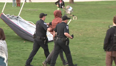 Police taking protestors into custody at University of New Hampshire