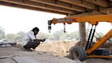 In India's heat, Delhi labourers toil in 'red hot' conditions