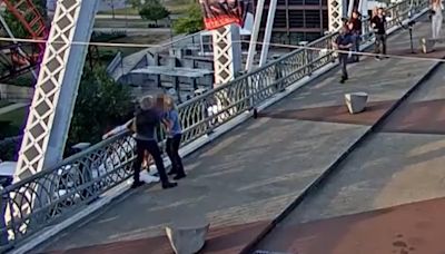 Video shows Jon Bon Jovi save a woman who was about to jump off a bridge, hug her