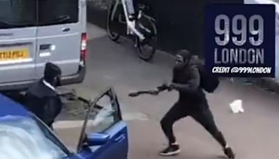 Thugs armed with Rambo knives fight in the middle of London street