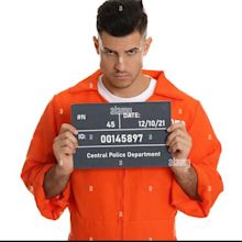 Mug shot of prisoner in orange jumpsuit with board on white background ...