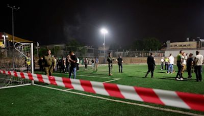 Israel says Hezbollah rocket kills 11 at football ground, vows response