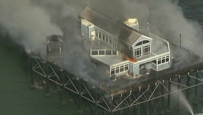 Fire crews contain spread of massive fire that erupted on historic Oceanside Pier